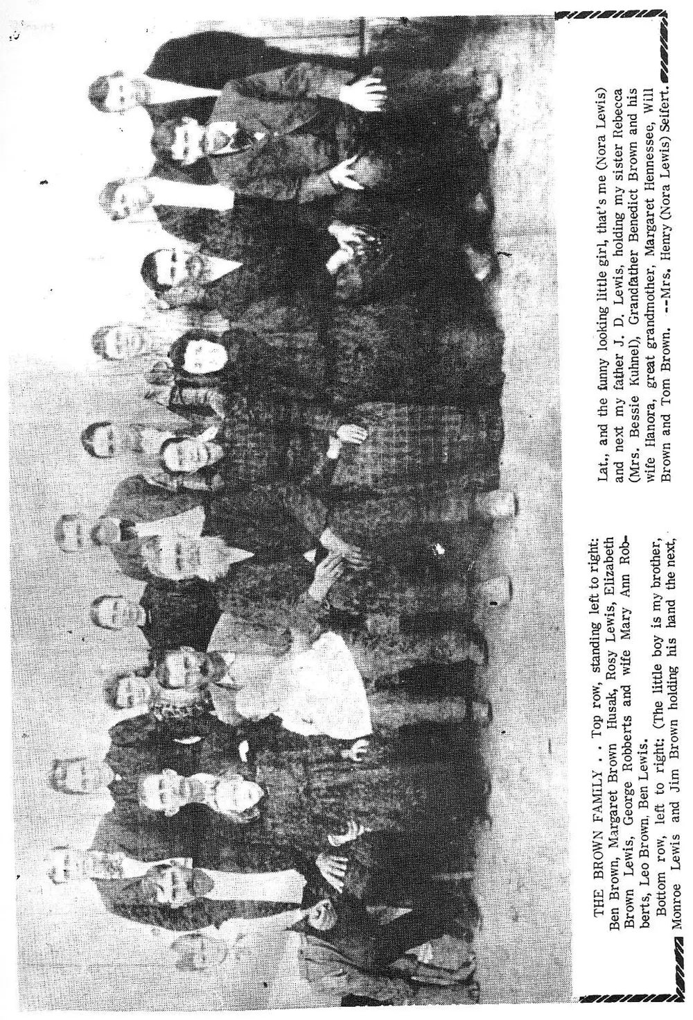 Group photograph of the Brown family, two rows of adults and children standing outdoors, rotated 90 degrees on the page.