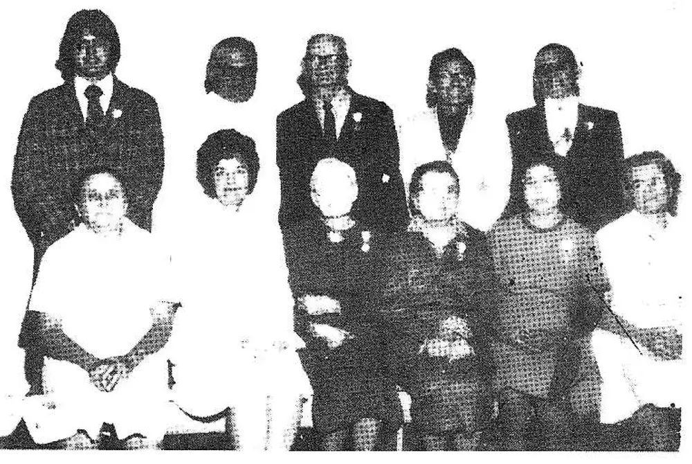 Group photo of parishioners receiving the Archbishop Furey Award, standing in a back row and seated/kneeling in a front row